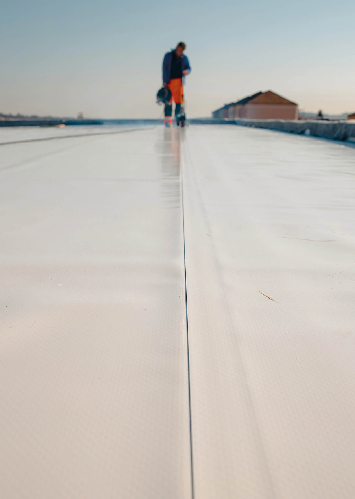 Waterproofing and insulation at construction site, waterproofing membrane preventing water penetration. Exterior vapor barrier for roof. 